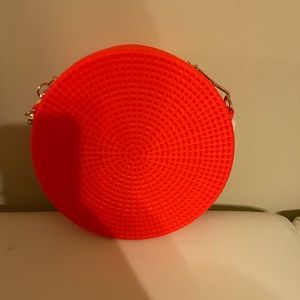 New orange round plastic purse